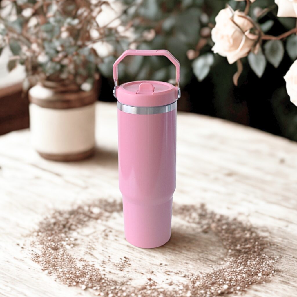 Straight front view of the Rose Dust tumbler with closed flip straw and top handle